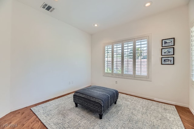 sitting room with hardwood / wood-style floors