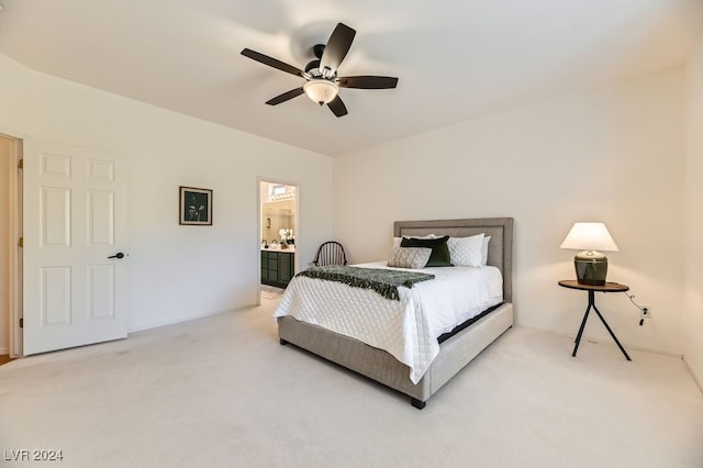 bedroom with carpet flooring, ceiling fan, and ensuite bathroom