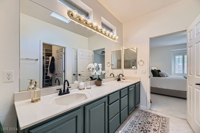 bathroom featuring tile patterned flooring and vanity