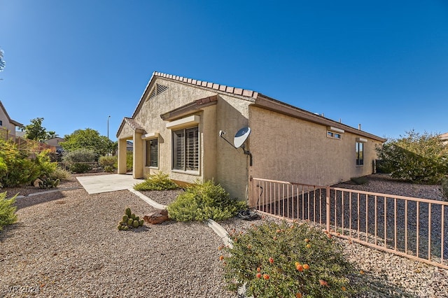 rear view of house with a patio