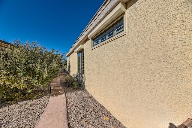 view of side of property featuring central AC