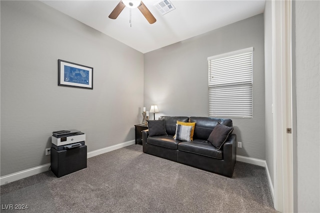 living room featuring carpet and ceiling fan