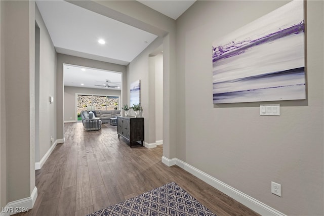 corridor with hardwood / wood-style floors