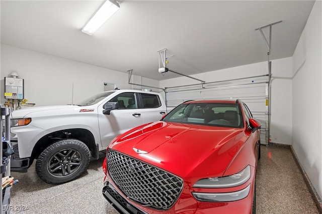 garage featuring tankless water heater and a garage door opener