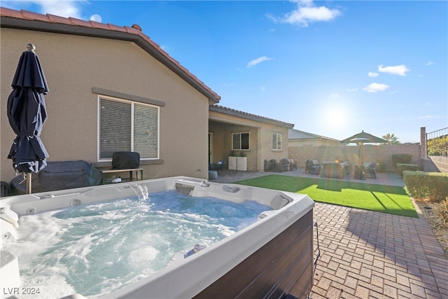 view of patio / terrace featuring a hot tub