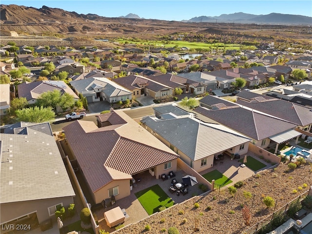 birds eye view of property featuring a mountain view