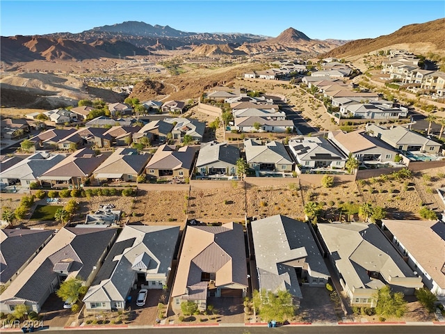 birds eye view of property featuring a mountain view