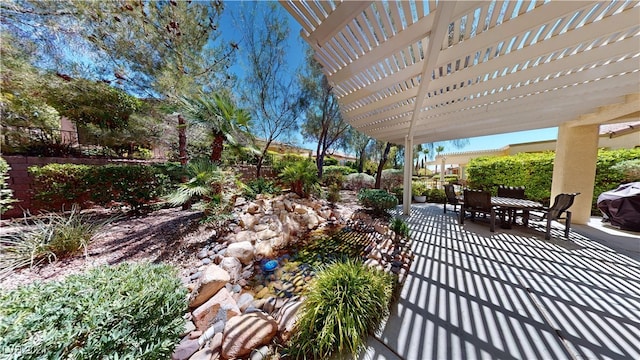 view of patio featuring a pergola