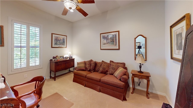 living room with light colored carpet and ceiling fan