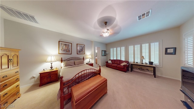 bedroom with light carpet and ceiling fan