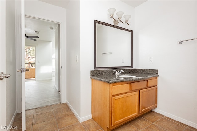 bathroom featuring vanity, tile patterned flooring, and ceiling fan