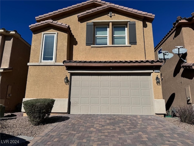 view of front of property featuring a garage