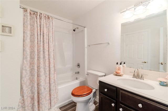 full bathroom with shower / tub combo, vanity, and toilet