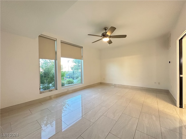 spare room with ceiling fan