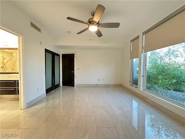 empty room featuring ceiling fan