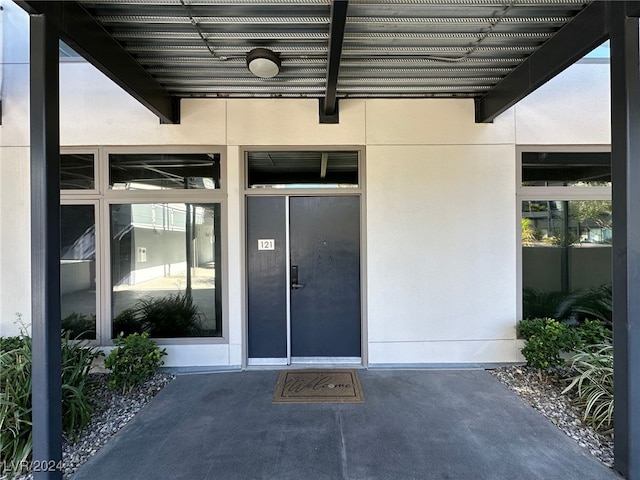 entrance to property with a pergola