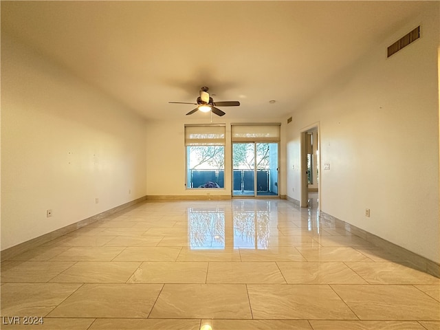 spare room with ceiling fan