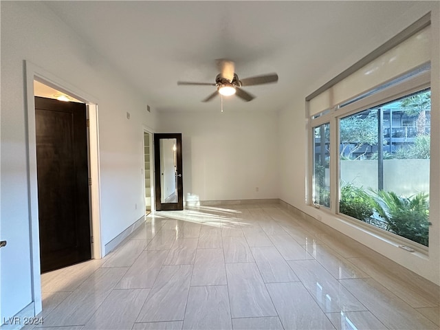 unfurnished room featuring ceiling fan