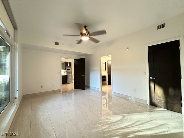 unfurnished room with ceiling fan