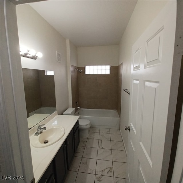 full bathroom featuring vanity, toilet, and tiled shower / bath