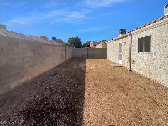 view of yard featuring central air condition unit