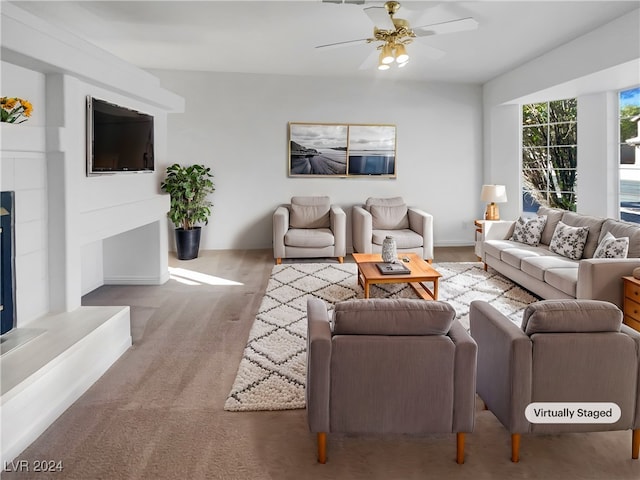 carpeted living room featuring ceiling fan