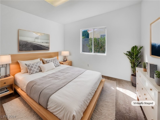 bedroom with wood-type flooring