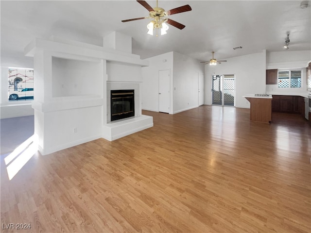 unfurnished living room with light hardwood / wood-style floors and ceiling fan