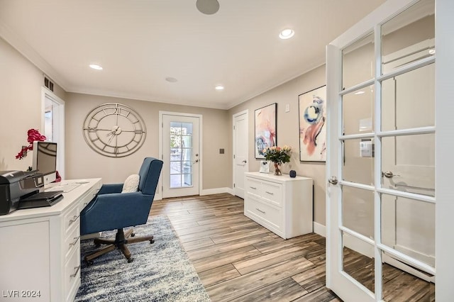 office space with french doors and crown molding