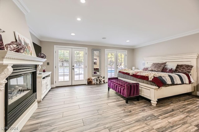 bedroom featuring french doors, access to exterior, ornamental molding, and light hardwood / wood-style floors