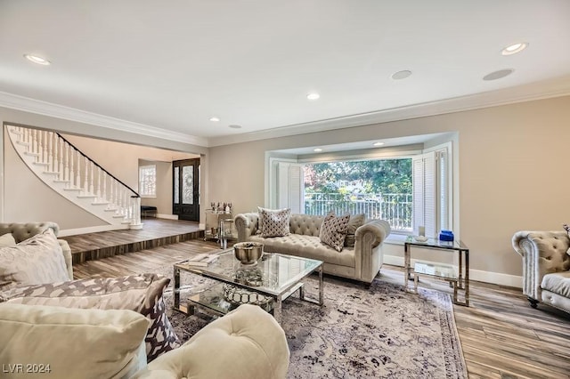 living room featuring hardwood / wood-style floors and ornamental molding