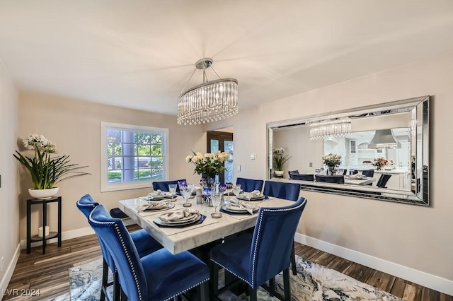 dining room featuring a chandelier and dark hardwood / wood-style floors