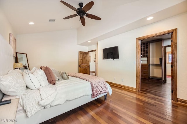 bedroom featuring lofted ceiling, ceiling fan, and dark hardwood / wood-style flooring