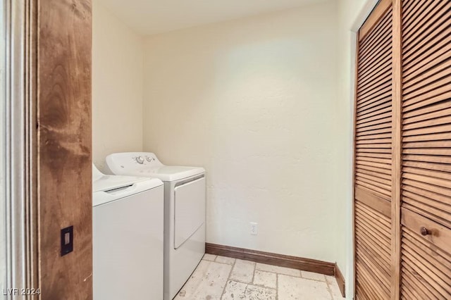 laundry room featuring washing machine and clothes dryer