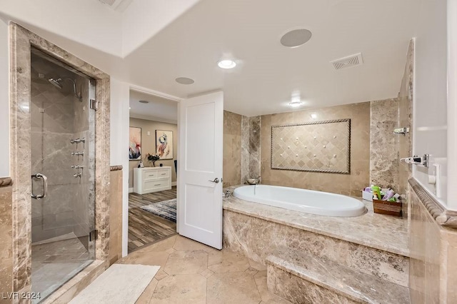 bathroom featuring tile patterned floors and independent shower and bath