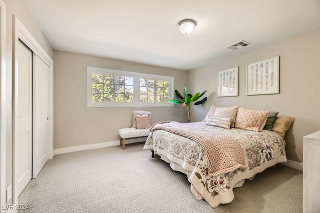 bedroom featuring a closet and carpet