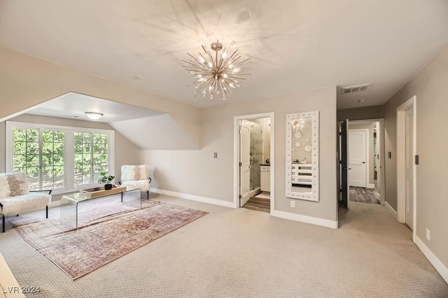 sitting room with light colored carpet, lofted ceiling, and a chandelier