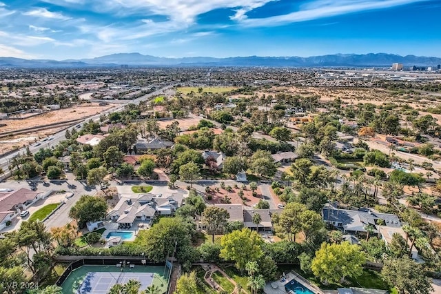 birds eye view of property with a mountain view