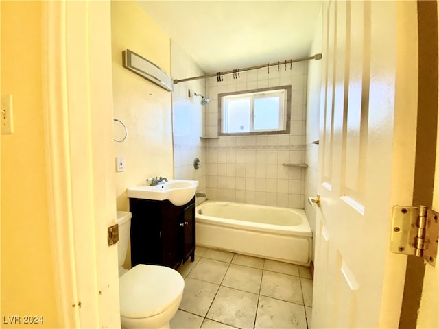 full bathroom with tile patterned floors, vanity, toilet, and tiled shower / bath