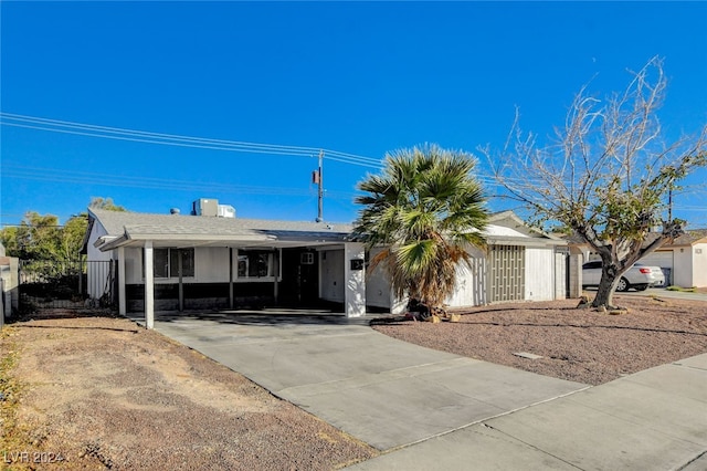 ranch-style home with a carport