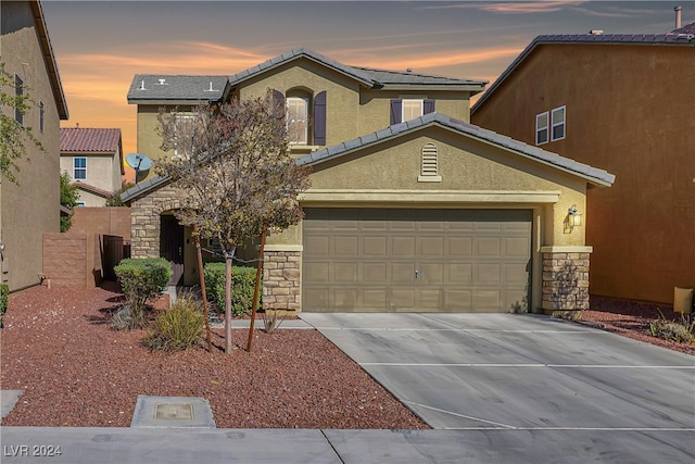 view of front of home with a garage