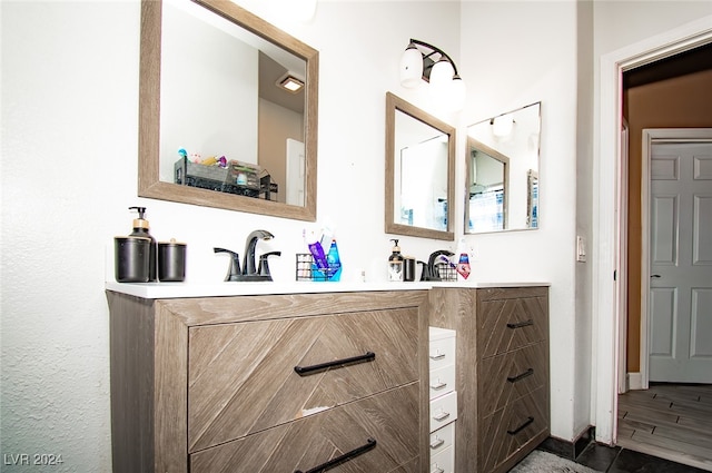 bathroom featuring vanity and hardwood / wood-style floors