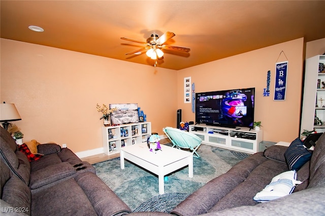 living room with hardwood / wood-style floors and ceiling fan