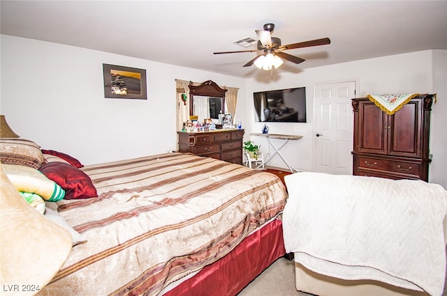 bedroom with ceiling fan and carpet