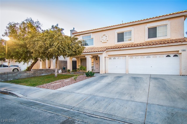 mediterranean / spanish-style house featuring a garage