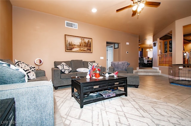 tiled living room featuring ceiling fan