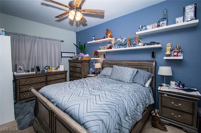 carpeted bedroom with ceiling fan