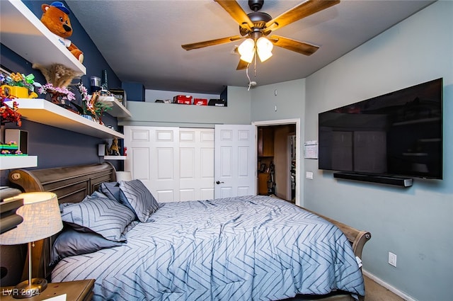 carpeted bedroom featuring a closet and ceiling fan