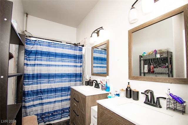 bathroom featuring walk in shower and vanity