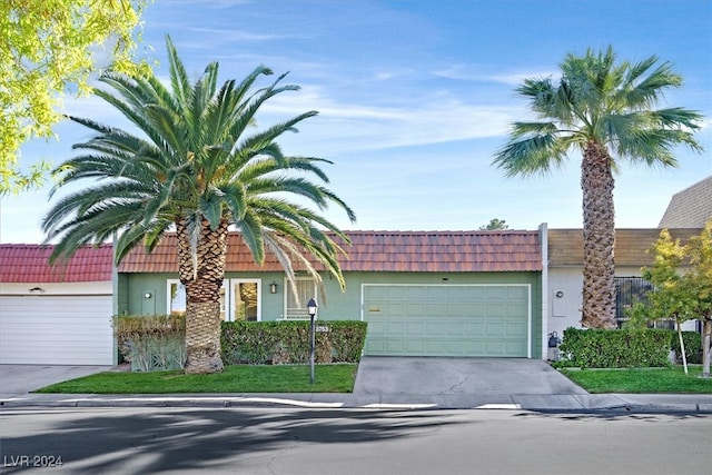 ranch-style home with a garage